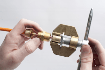 Mineral Insulated Copper Clad Cable being crimped with a Wrexham Mineral Cables hand crimper